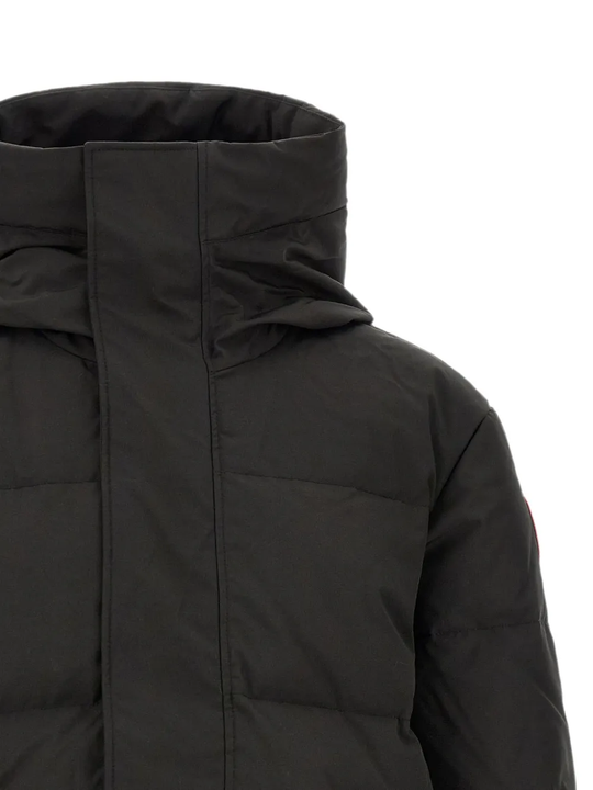 Close up of Black jacket, showing texture of the 84% recycled polyester/ 16% organic cotton made fabric