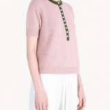 Pink shirt worn by a person, showing the shirt fit