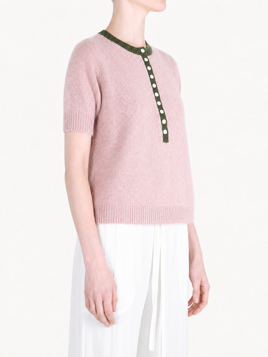 Pink shirt worn by a person, showing the shirt fit