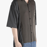 Brown shirt worn by a person, showing the shirt's fit