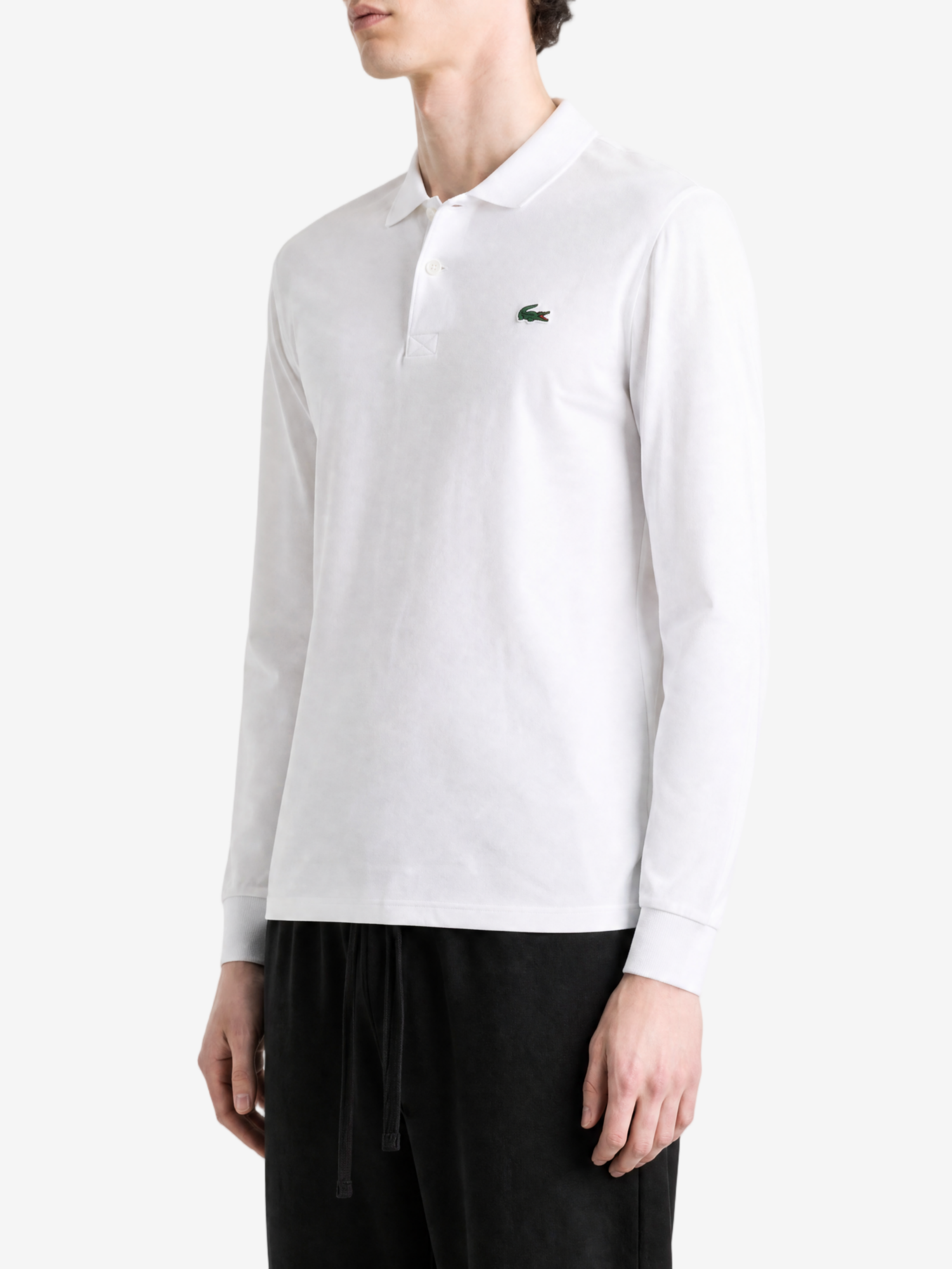 White shirt worn by a person, showing the shirt fit