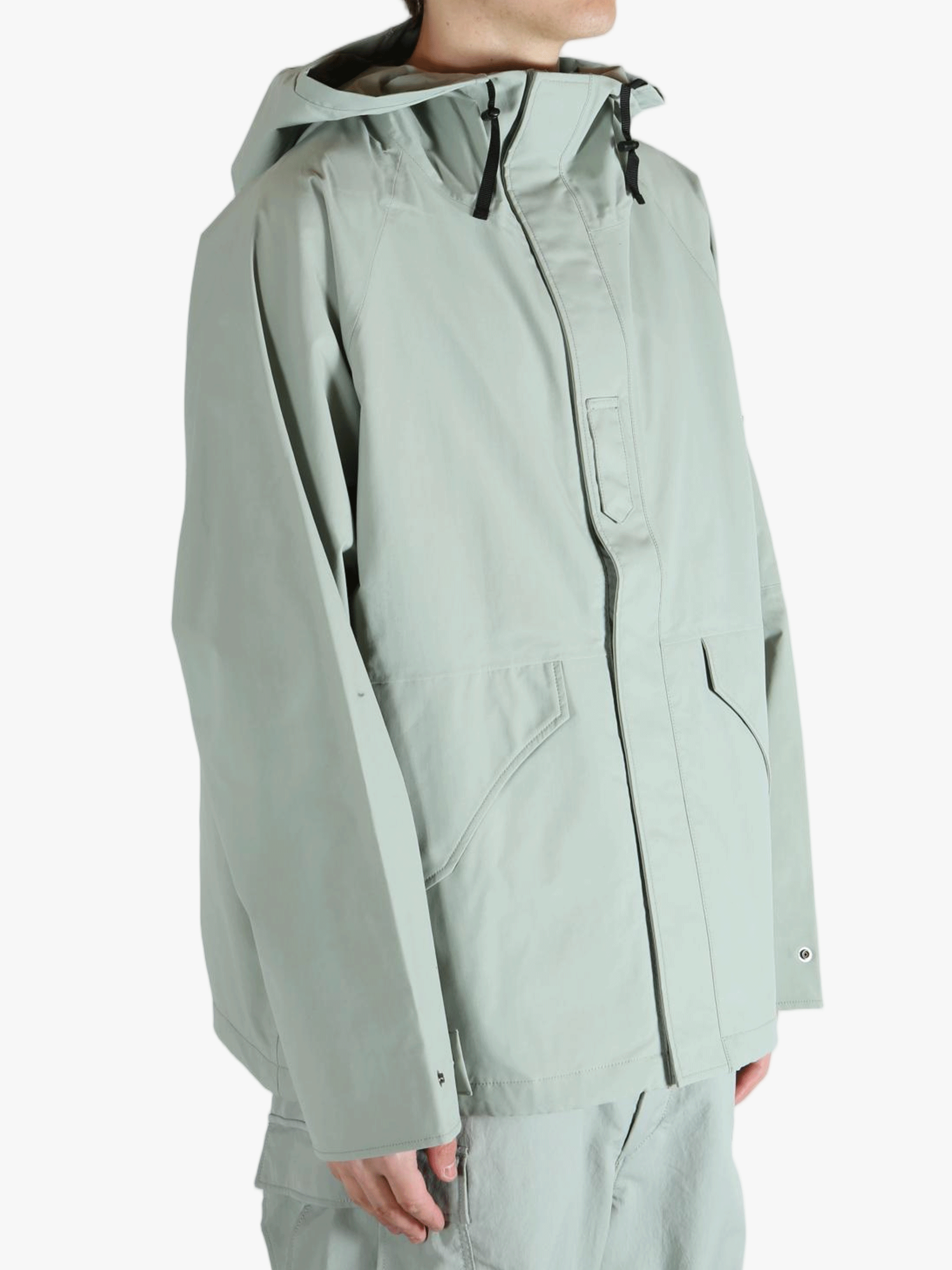 Grey jacket worn by a person, showing the jacket's fit