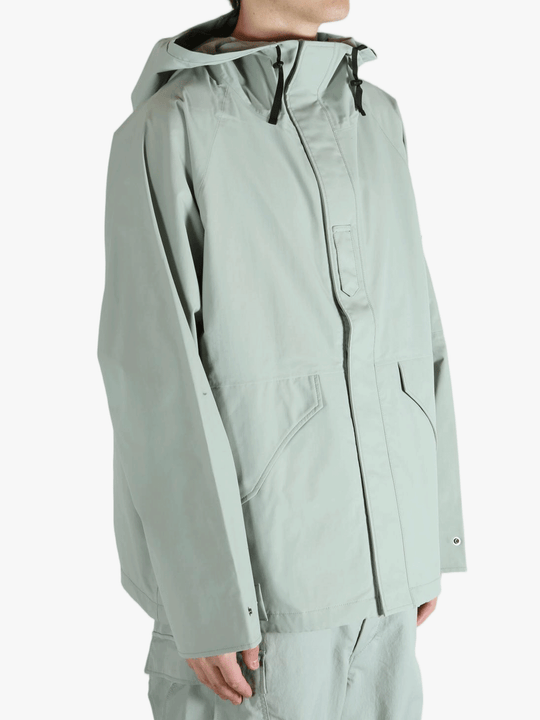 Grey jacket worn by a person, showing the jacket's fit
