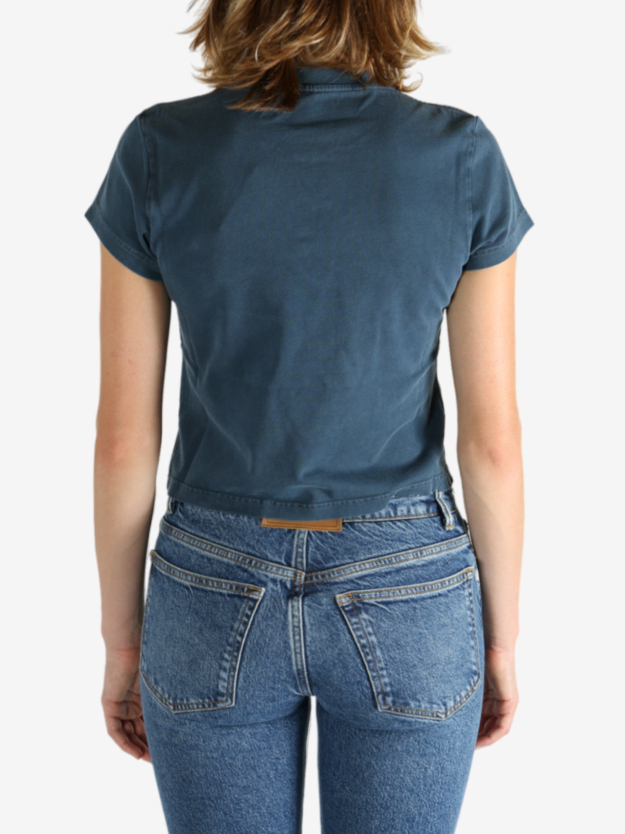 Blue t-shirt worn by a person, showing the shirt's fit