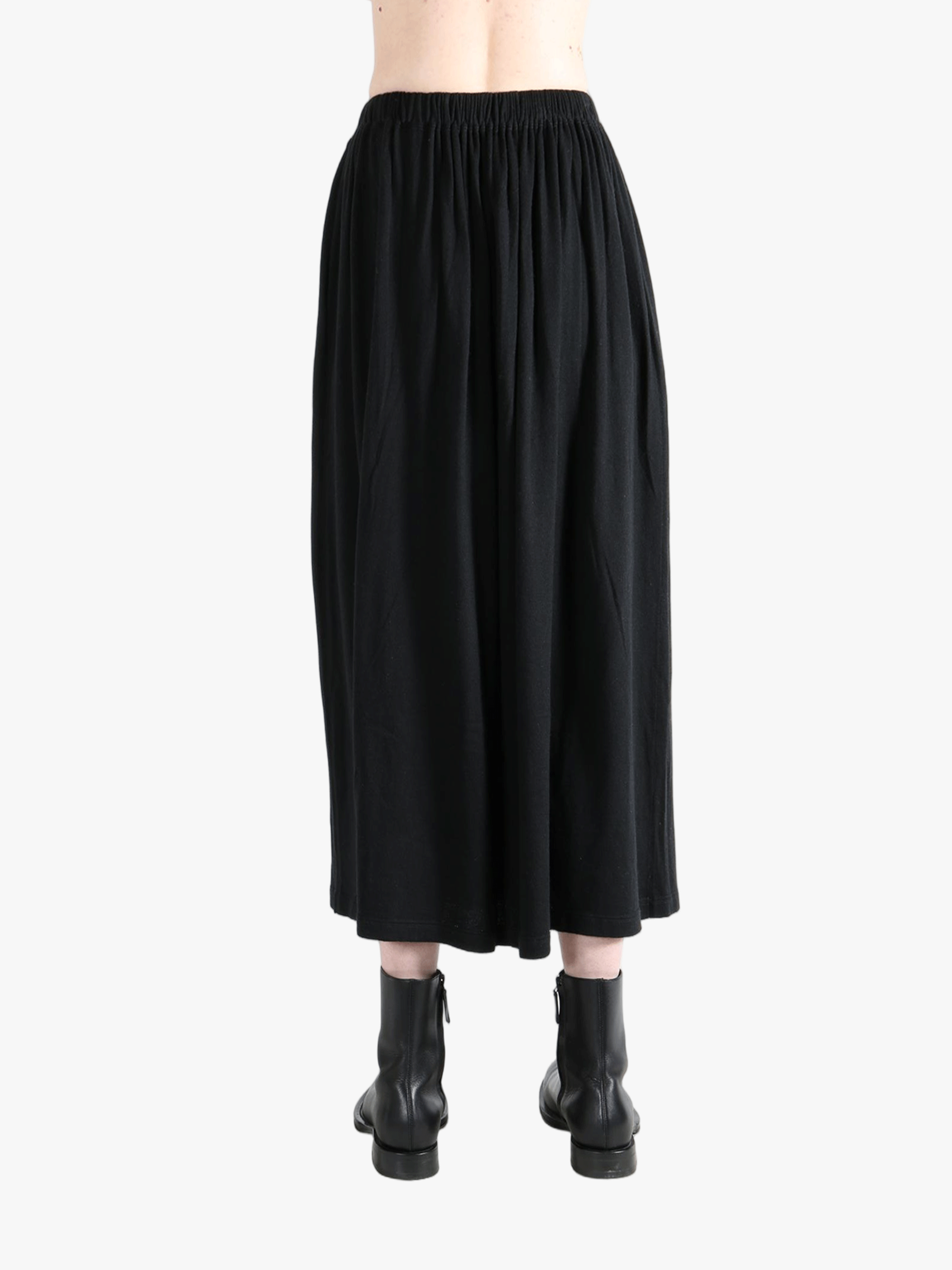 Black skirt worn by a person,showing the skirt fit