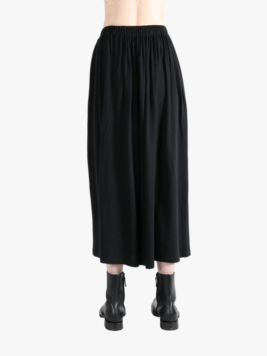 Black skirt worn by a person,showing the skirt fit