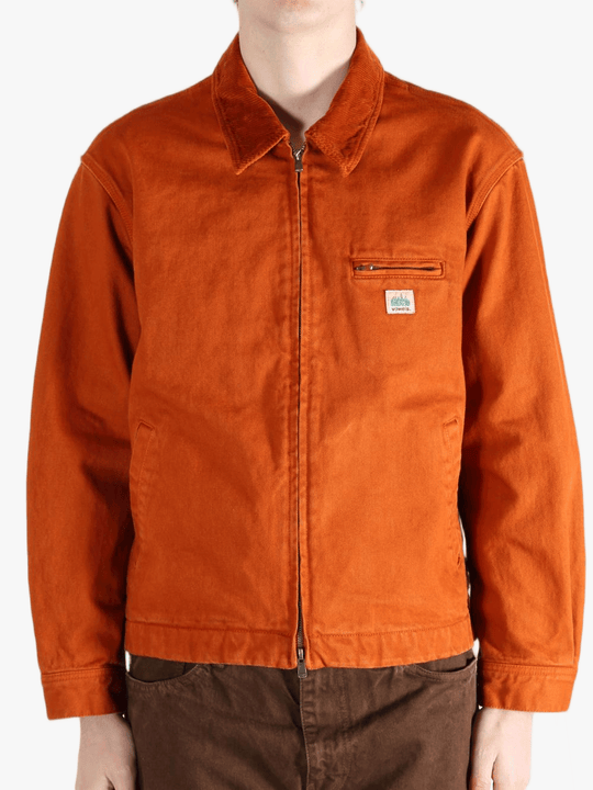 Orange jacket worn by a person, showing the jacket fit