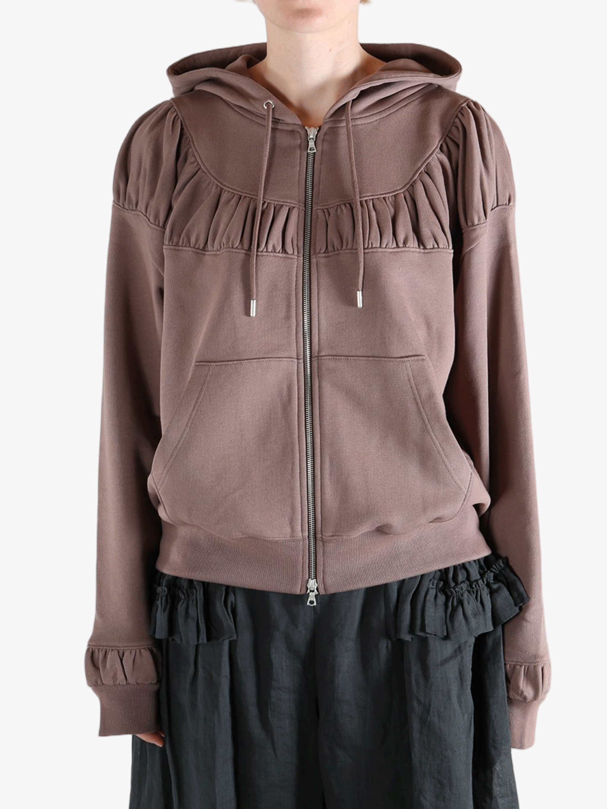 Tan hoodies worn by a person, showing the hoodies fit