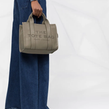 Tan bag worn by a person, showing the bag's fit
