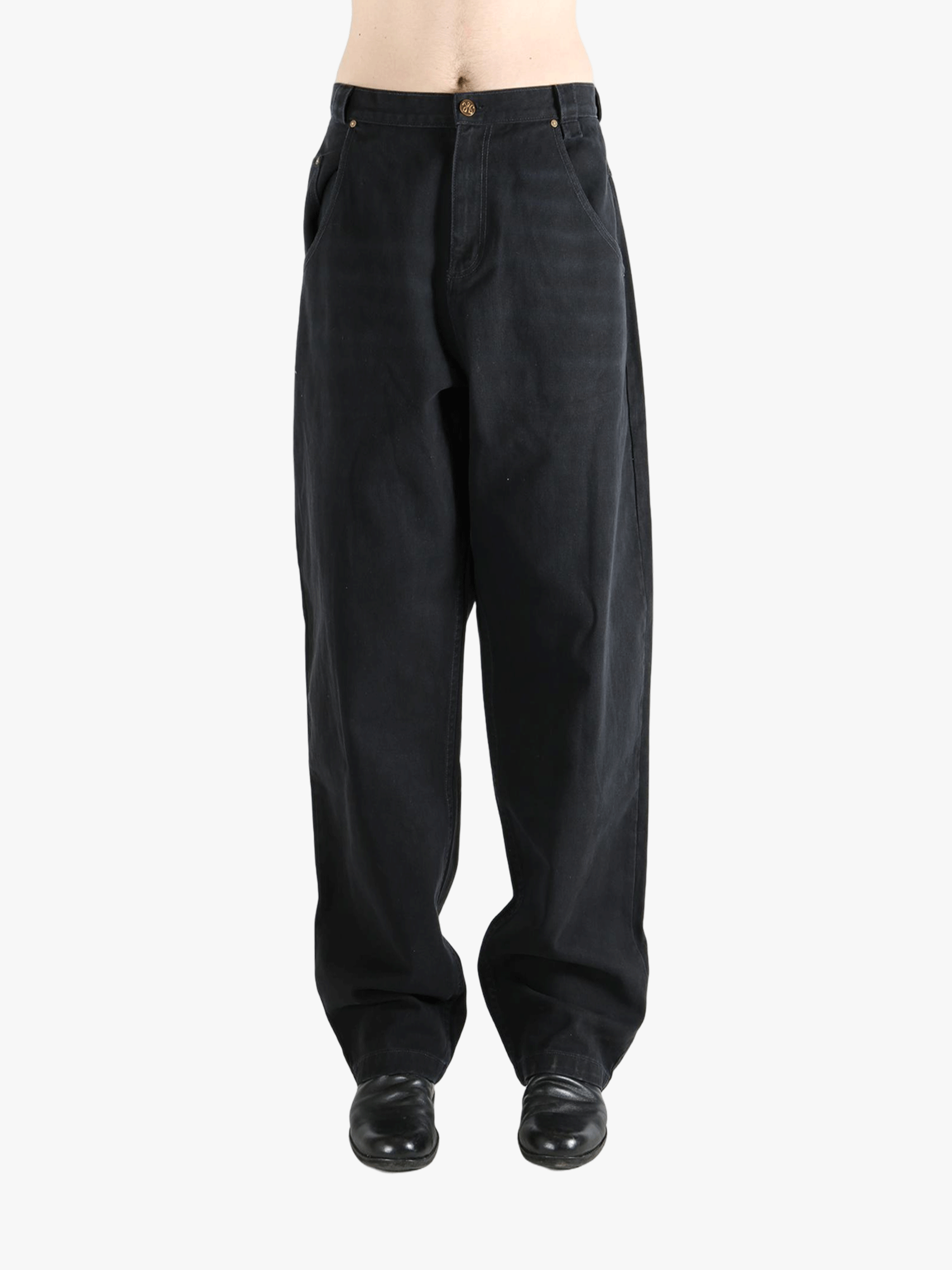 Black jean,worn by a person, showing the jeans fit