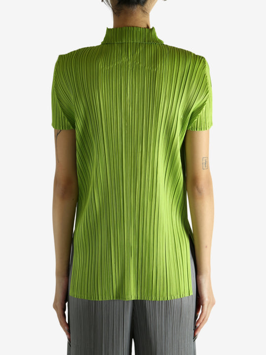 Green shirt worn by a person, showing the shirt's fit