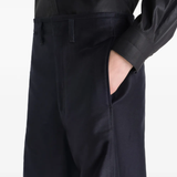 Close up of black pant, showing texture of the cotton fabric