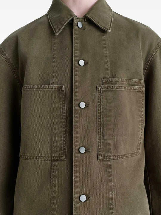 Close up of the green shirt, showing texture of the cotton fabric