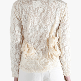 White shirt worn by a person, showing the shirt's fit