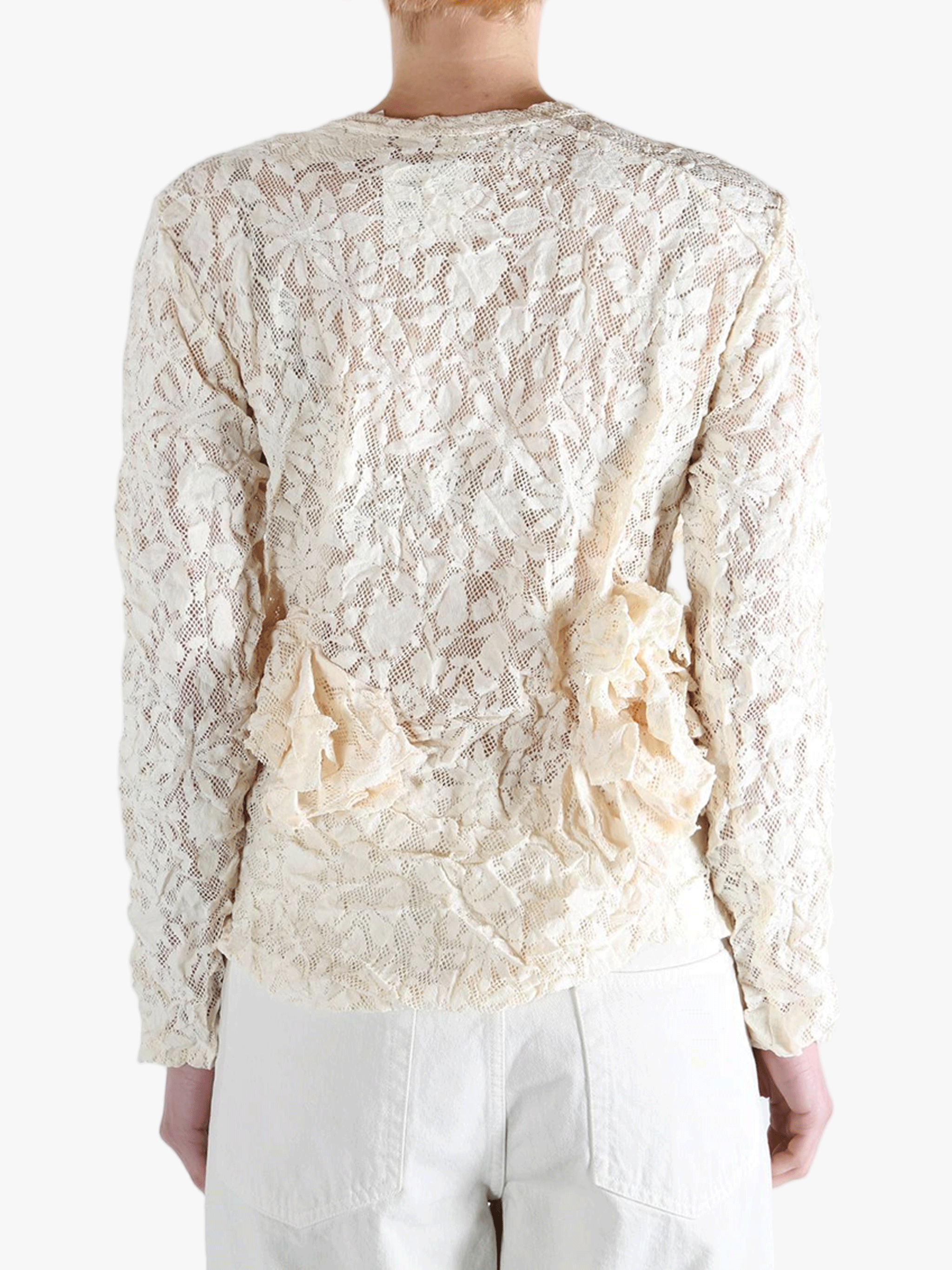 White shirt worn by a person, showing the shirt's fit