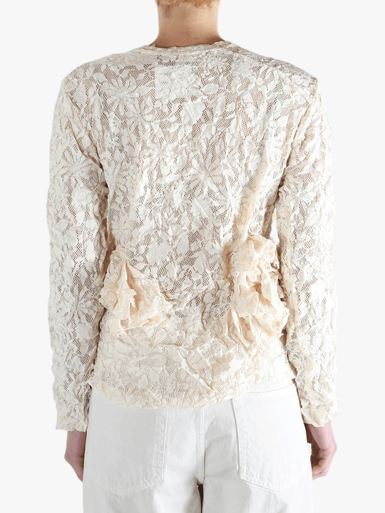 White shirt worn by a person, showing the shirt's fit