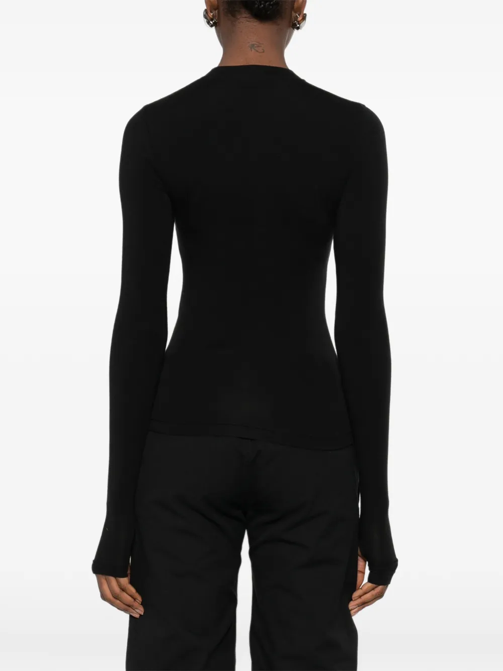 black tops worn by a person, showing the tops fit