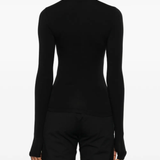 black tops worn by a person, showing the tops fit