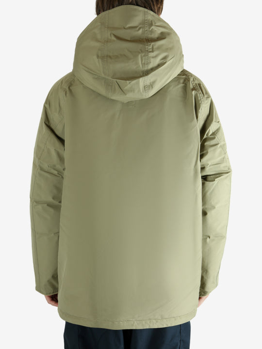 Green jacket worn by a person, showing the jacket's fit