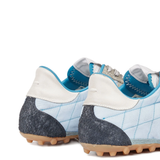 Close up of blue shoes, showing texture of the polyester fabric