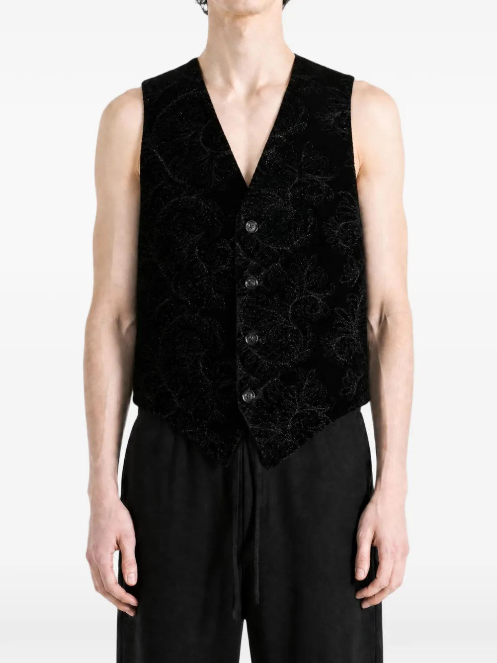 Black jacket worn by a person, showing the jacket fit