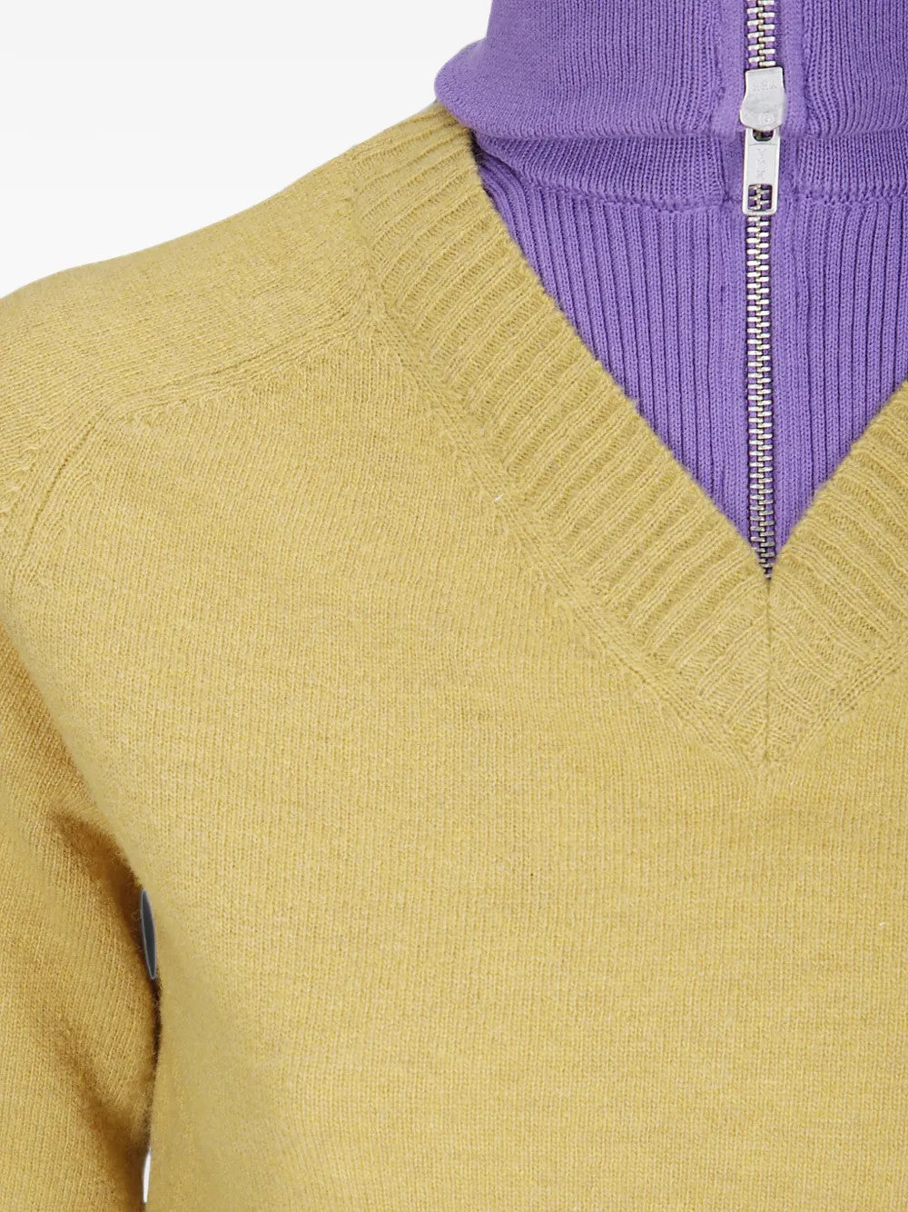 Yellow knitwear worn by a person, showing the knitwear fit