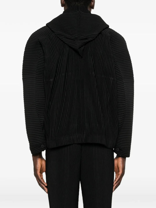 Black blouson worn by a person, showing the blouson's fit