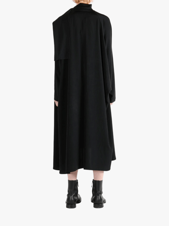 Black dress worn by a person, showing the dress' fit