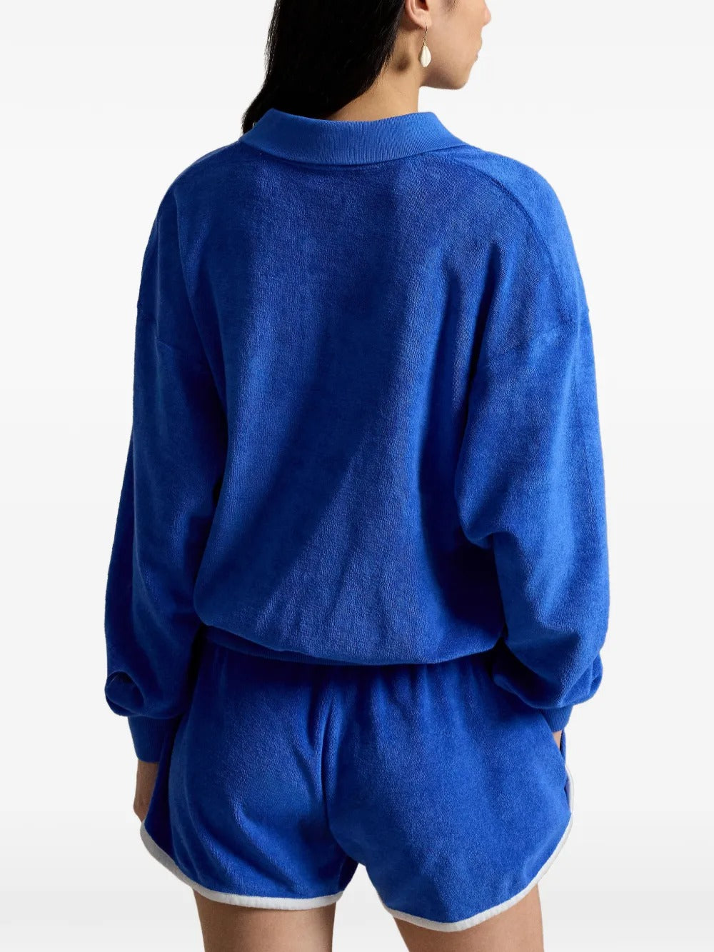 Blue top worn by a person, showing the top's fit