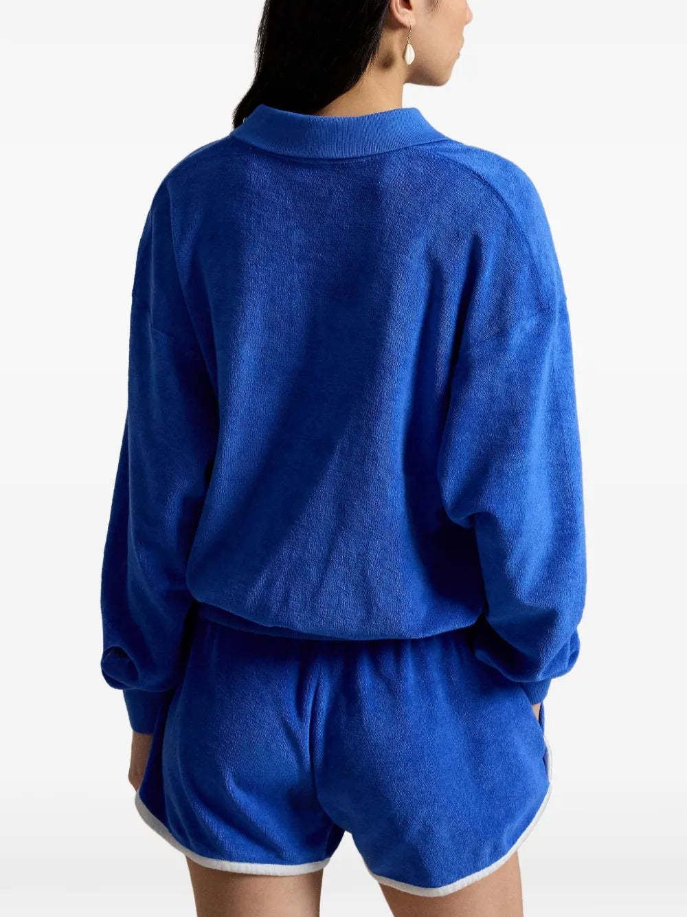 Blue top worn by a person, showing the top's fit