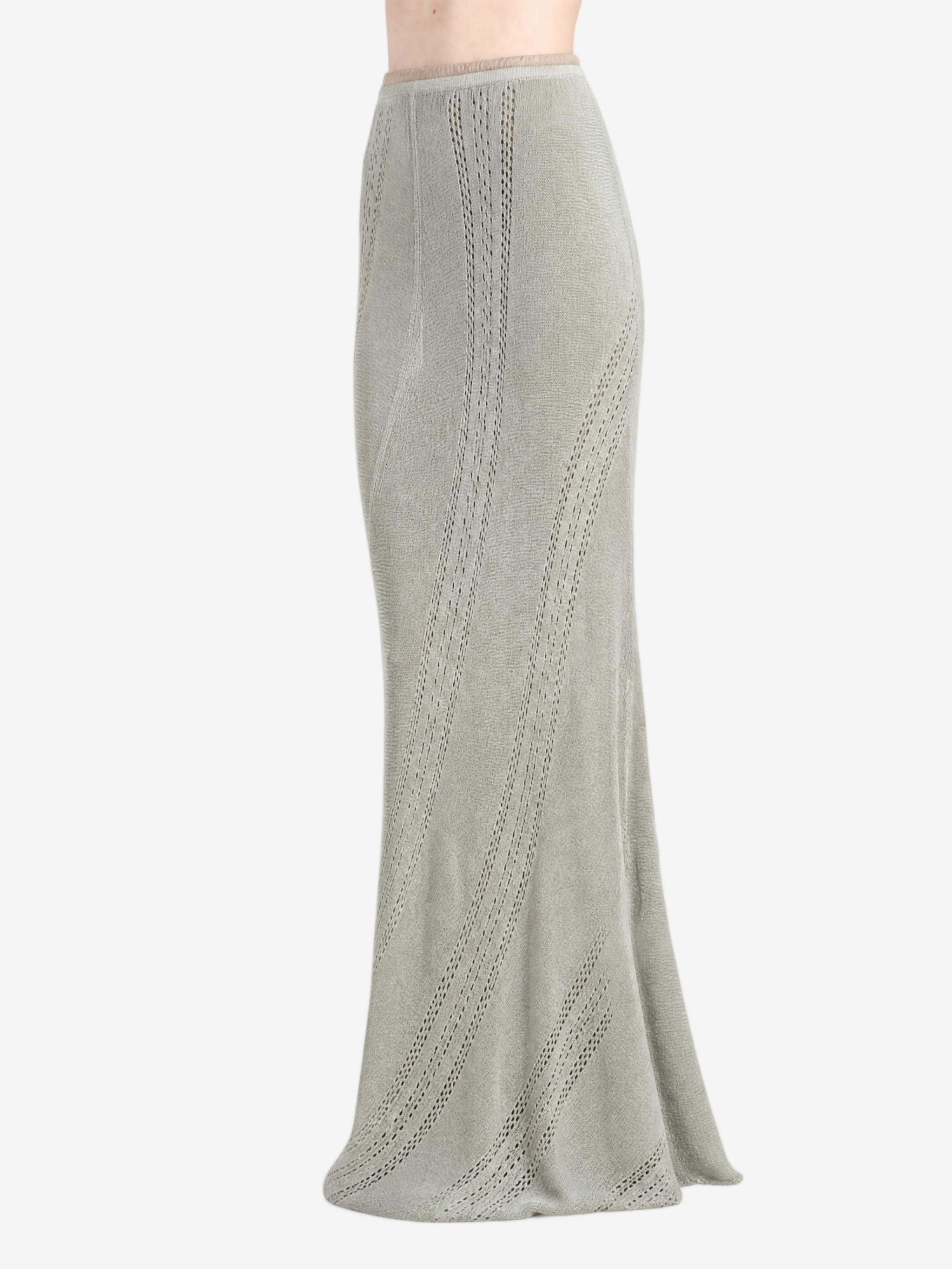 Green skirt worn by a person, showing the skirt fit
