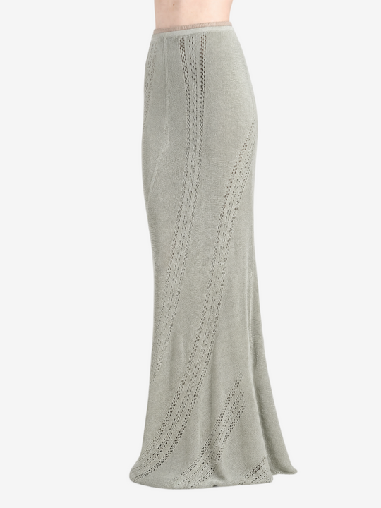 Green skirt worn by a person, showing the skirt fit