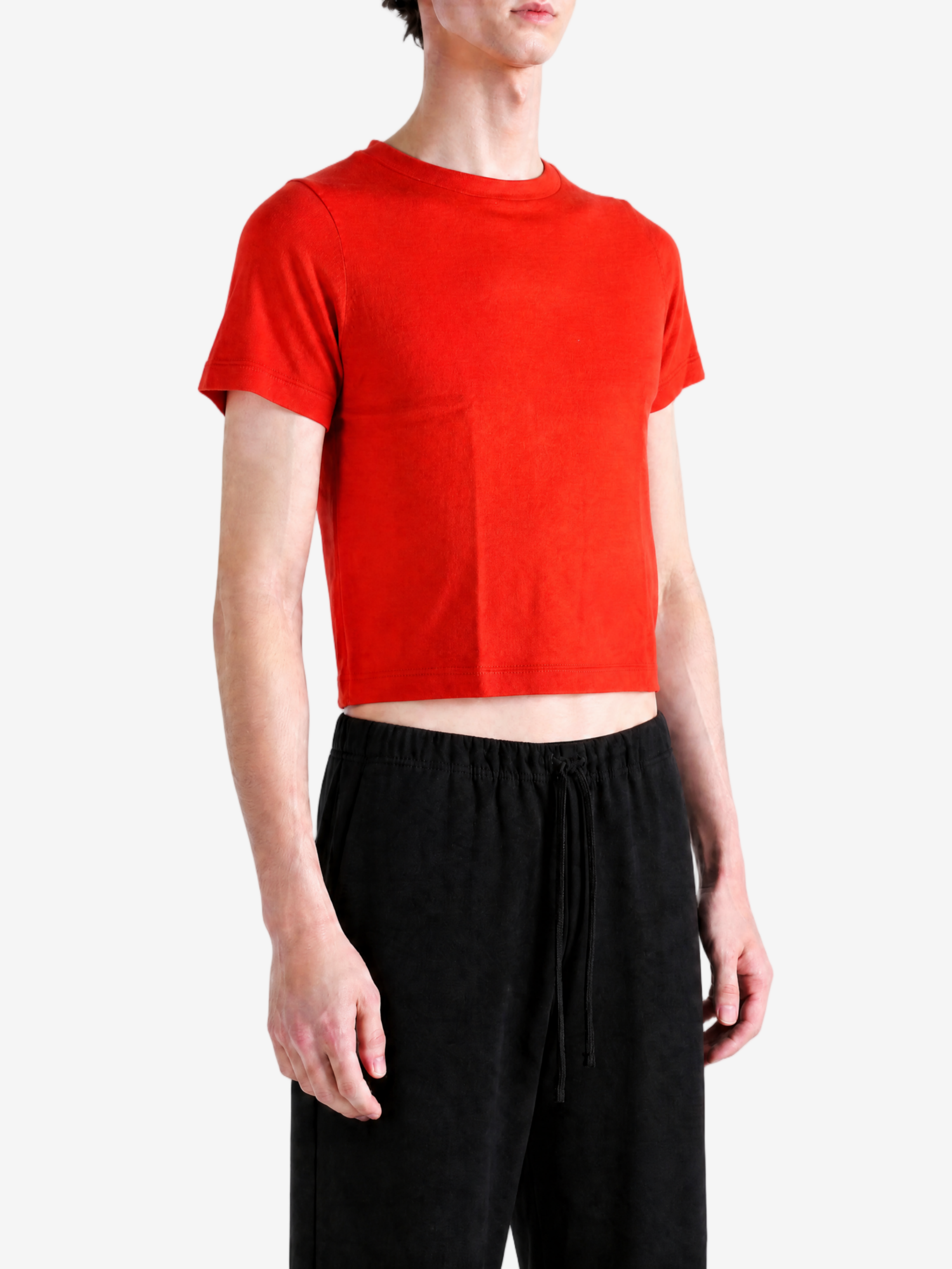 Red top worn by a person, showing the top fit