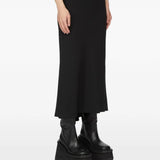 Black skirt worn by a person, showing the skirt fit