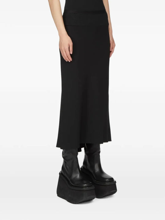 Black skirt worn by a person, showing the skirt fit