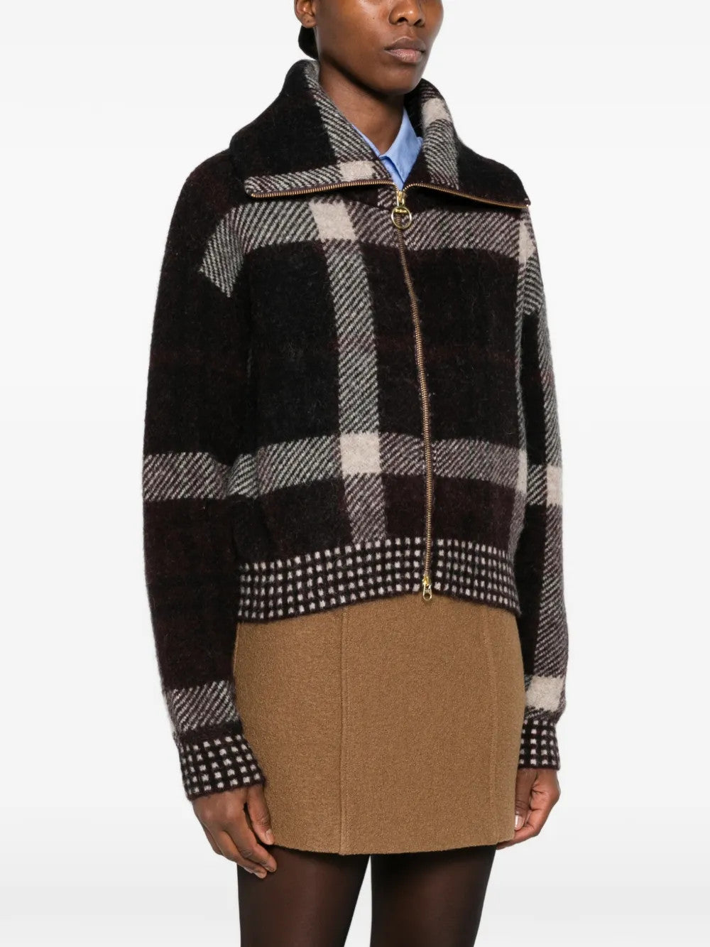 Brown jacket worn by a person, showing the jacket fit