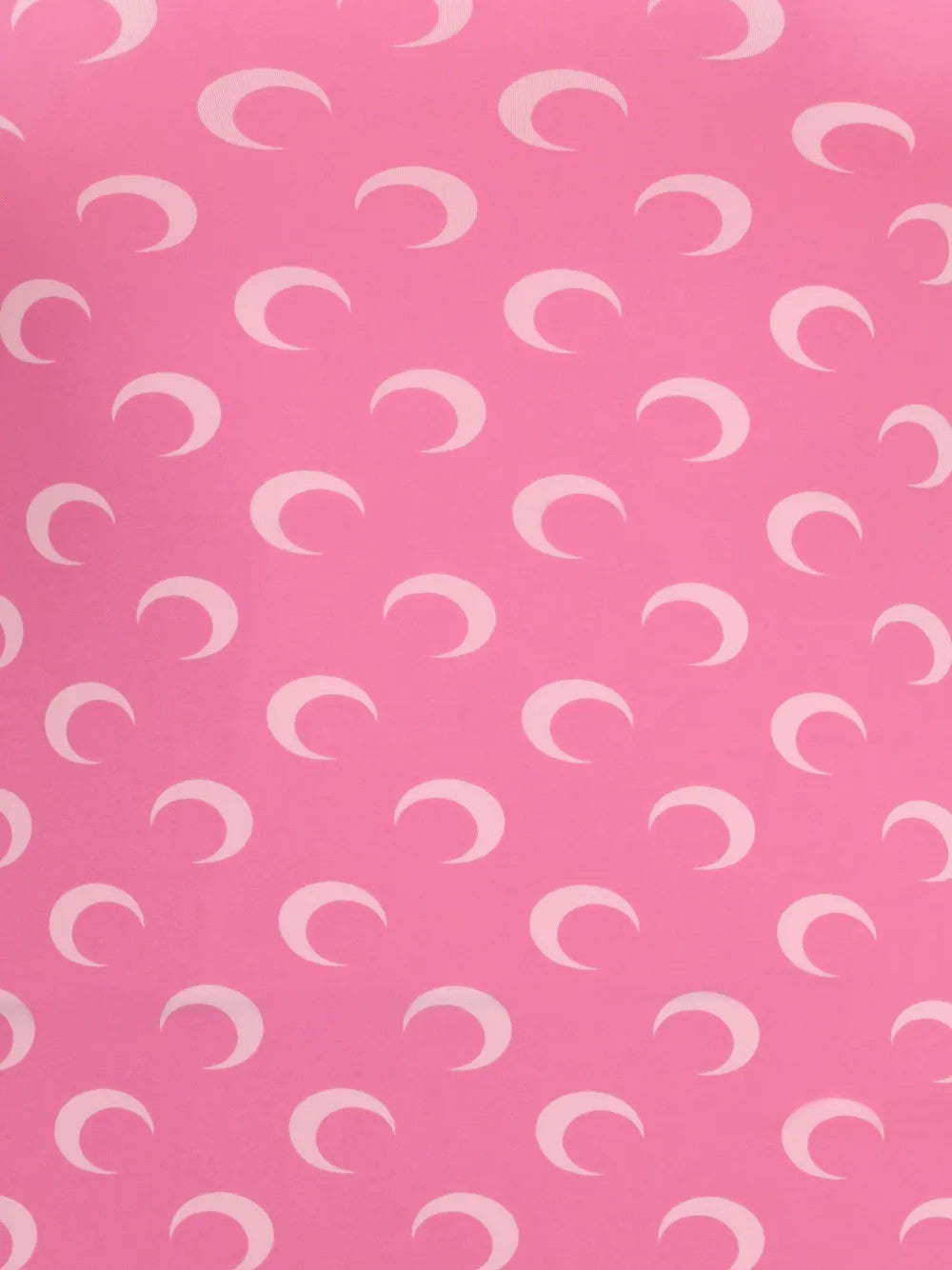 Close up of Pink top, showing texture of the 88% recycled polyamide/ 12% recycled elastane made fabric
