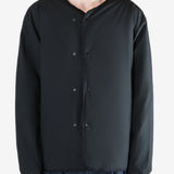 Black cardigan worn by a person, showing the cardigan's fit