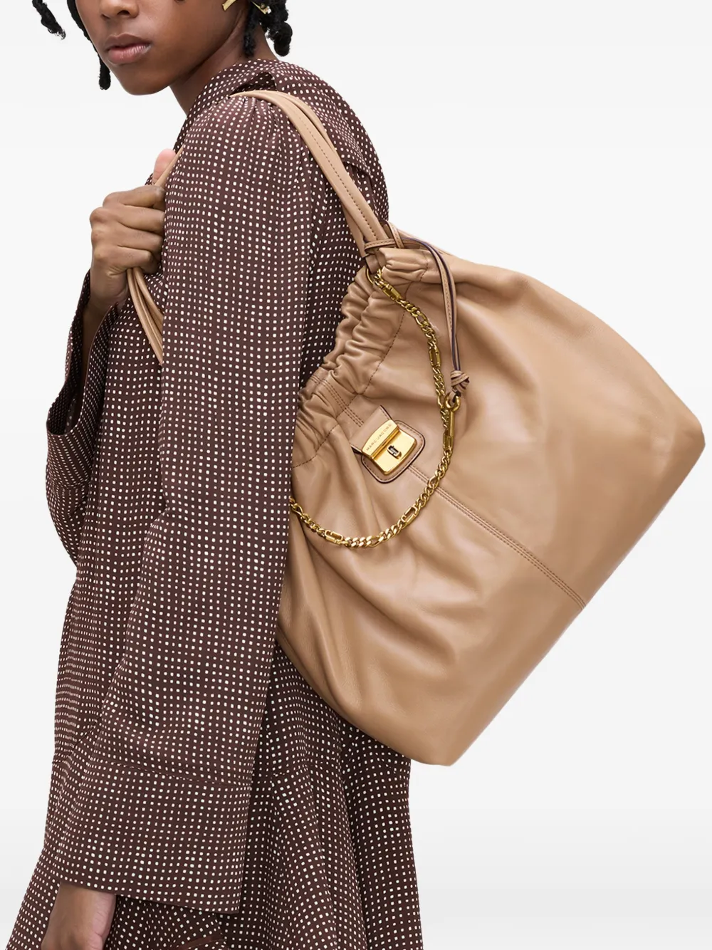 Brown bags worn by a person, showing the bags fit