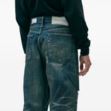 Blue pants worn by a person, showing the pants's fit