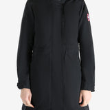 Black coat worn by a person, showing the coat fit