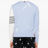 Blue knitwear worn by a person, showing the knitwear's fit