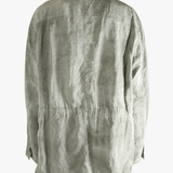 Green jacket worn by a person, showing jacket's fit