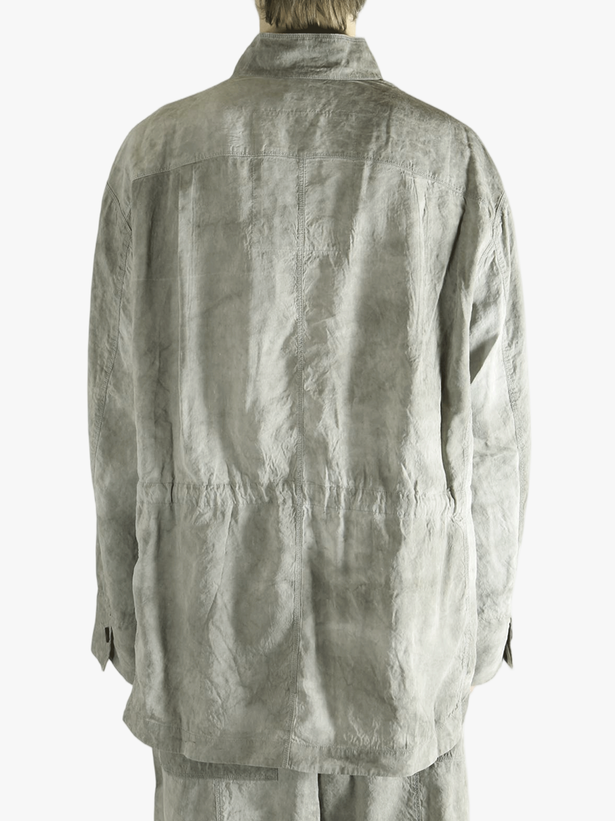 Green jacket worn by a person, showing jacket's fit