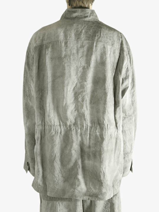 Green jacket worn by a person, showing jacket's fit