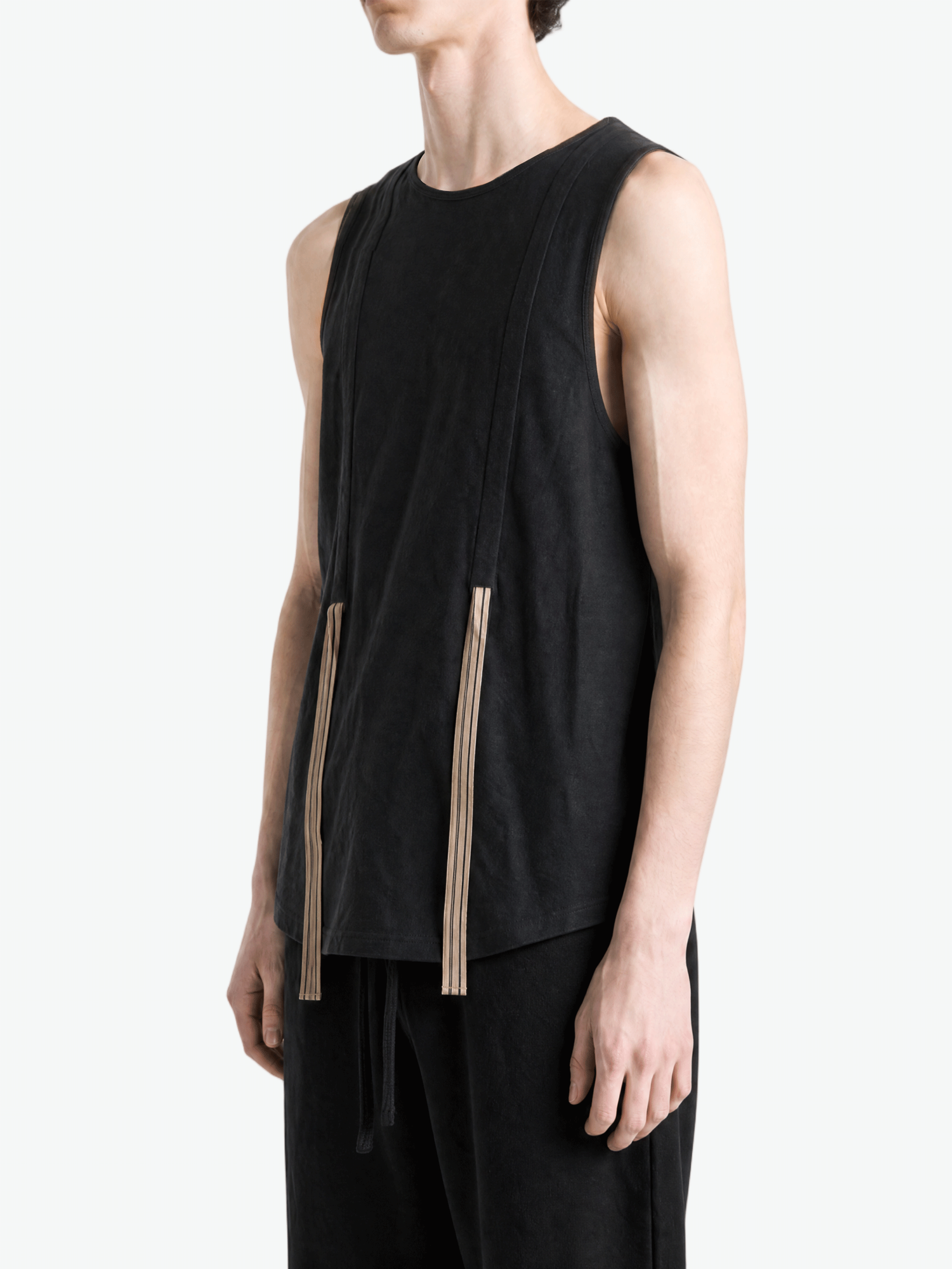 Black top worn by a person, showing the top fit