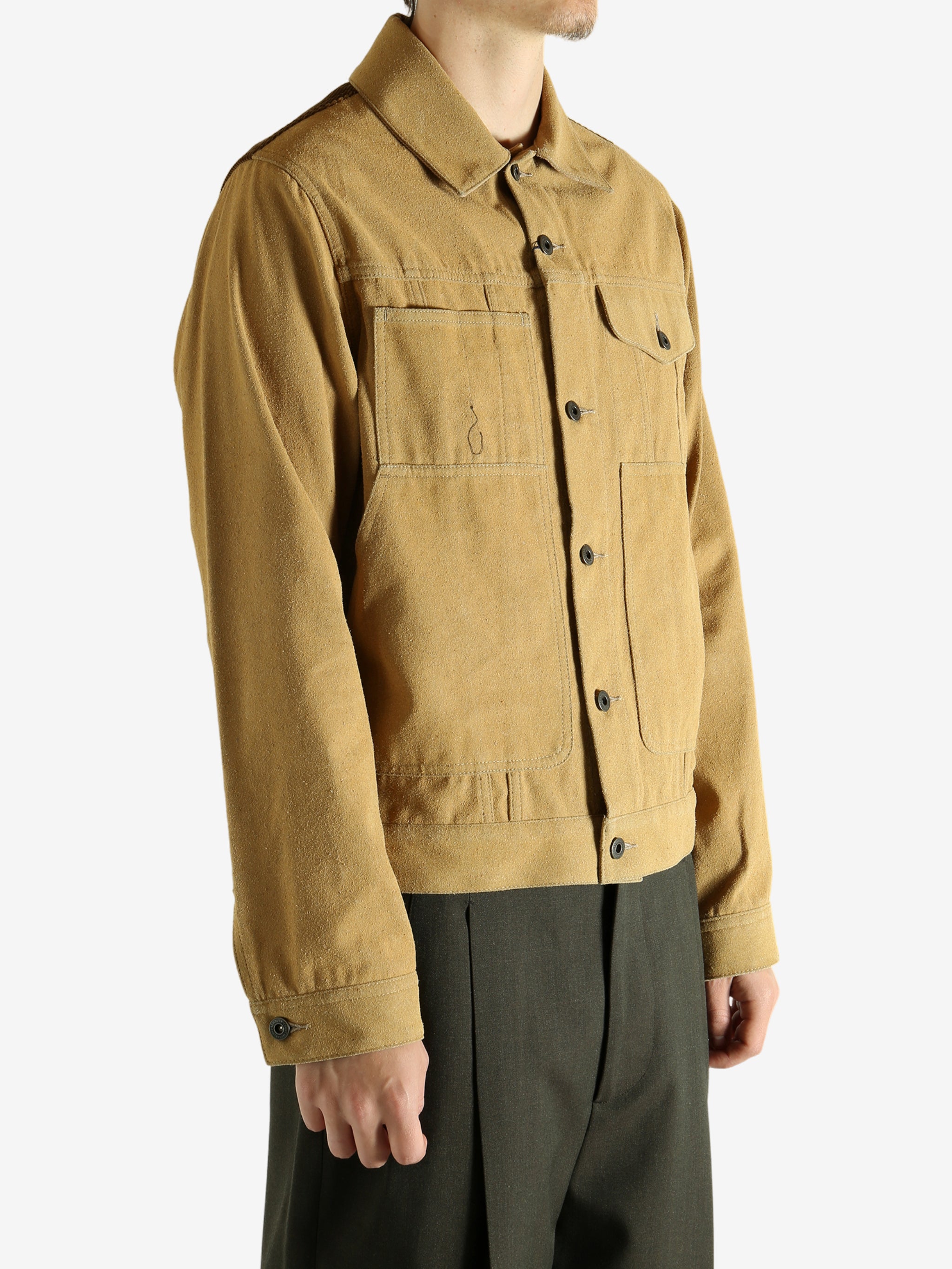 Yellow jacket worn by a person, showing the jacket's fit