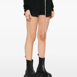 black shorts worn by a person, showing the short fit