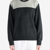 Grey hoodie worn by a person, showing the hoodie fit
