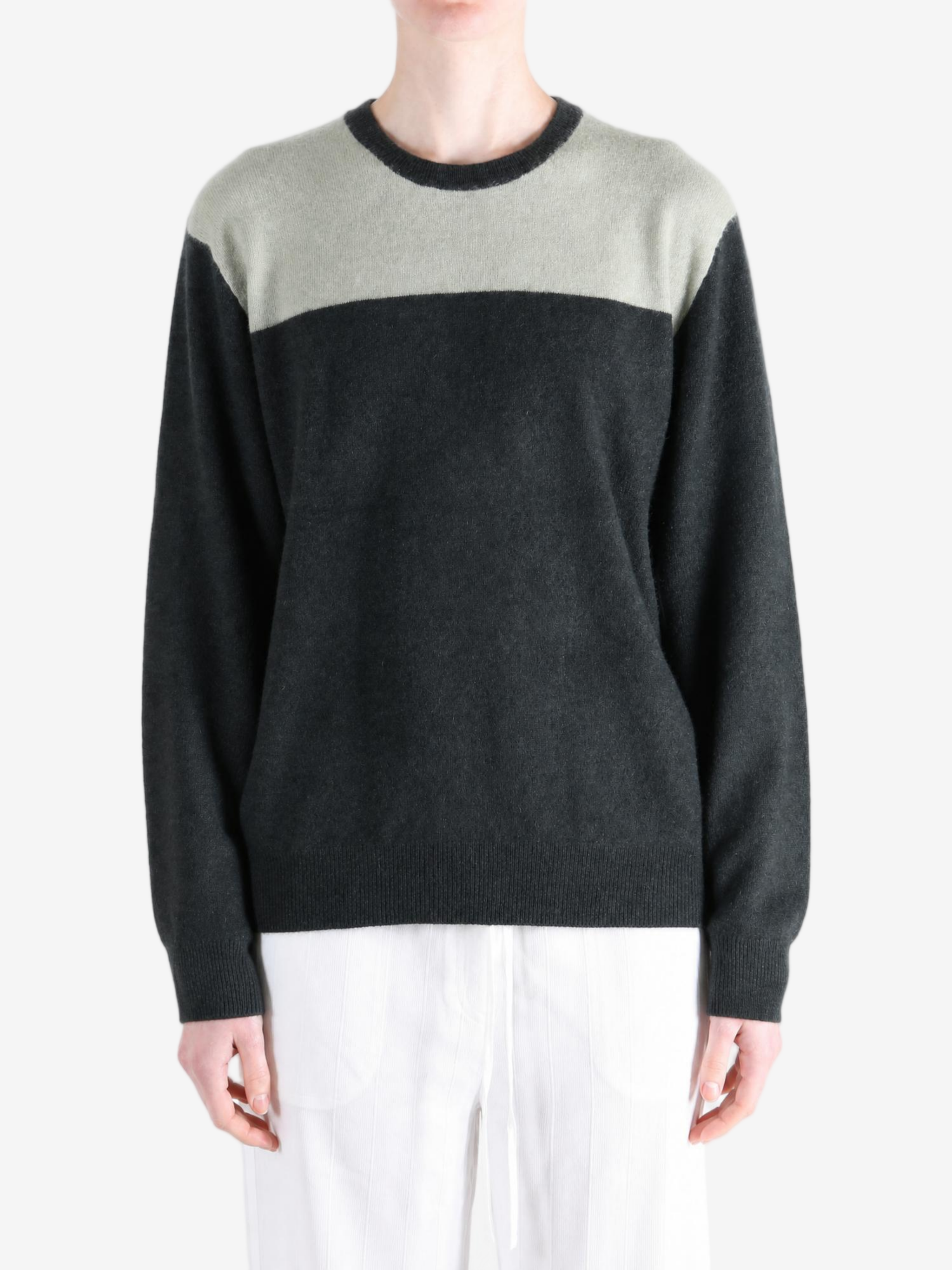 Grey hoodie worn by a person, showing the hoodie fit